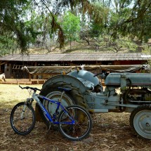 Fancy mountain bike with ancient tractor